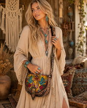 Load image into Gallery viewer, Woman wearing Luxe Love Story hand painted leather crossbody boho bag with bluebird and floral artwork