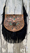 Load image into Gallery viewer, Close-up of the Midnight Oasis black leather crossbody bag featuring intricate hand tooling, turquoise accents and gemstone detail.