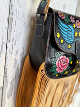 Load image into Gallery viewer, Midnight Starfall hand painted leather fringe crossbody bag with celestial wings, roses and long flowing tan fringe