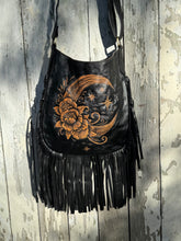 Load image into Gallery viewer, Moonflower hand tooled leather fringe boho bag with crescent moon and floral design on black genuine leather.
