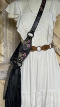 Load image into Gallery viewer, Mushroom Magic handcrafted leather shoulder bag strap styled over a white bohemian dress, showing detailed purple mushroom artwork.
