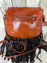 Load image into Gallery viewer, Rear view of Mystic Sky Wings hand tooled leather boho fringe crossbody bag with zip pocket and dark chocolate fringe