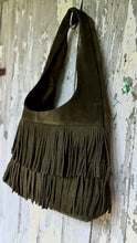 Load image into Gallery viewer, Close-up of olive green suede leather boho shoulder bag featuring soft suede texture and layered fringe.