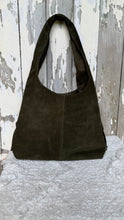 Load image into Gallery viewer, Rear view of olive green genuine suede leather shoulder bag with relaxed bohemian slouch style.