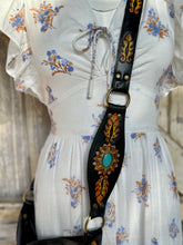 Load image into Gallery viewer, Hand tooled leather strap detail with painted feathers and turquoise stone accent.
