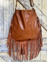 Load image into Gallery viewer, Back view of Palm Dreams hand tooled leather crossbody fringe bag in genuine brown leather by Dreamtime Boho