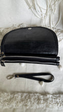 Load image into Gallery viewer, Black genuine leather wallet clutch open showing two large zip coin compartments and wristlet strap