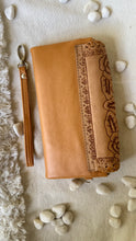 Load image into Gallery viewer, Tan hand tooled leather wallet clutch showing floral back detailing and removable wristlet