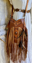 Load image into Gallery viewer, Brown hand tooled boho leather crossbody bag with double fringe, gemstone detail and adjustable leather strap.