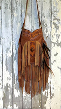 Load image into Gallery viewer, Rustic Feather hand tooled genuine leather double fringe crossbody bag in brown with gemstone feature and feather accents.