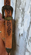 Load image into Gallery viewer, Side view of the Rustic Feather hand crafted leather boho bag highlighting detailed strap and buckle