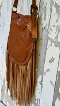 Load image into Gallery viewer, Back view of the Rustic Feather genuine leather crossbody bag showing smooth leather and long fringe.