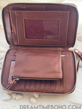 Load image into Gallery viewer, Open hand tooled leather wallet showing spacious interior, note sections and zippered coin pocket. Boho leather wallet