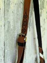Load image into Gallery viewer, Hand-tooled leather strap and antique brass buckle detail on Sahara Moon black and tan fringe boho crossbody bag by Dreamtime Boho, shipped worldwide from Queensland Australia