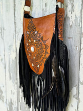 Load image into Gallery viewer, Flowing leather fringe detail on Sahara Moon black and tan hand-tooled boho crossbody bag by Dreamtime Boho