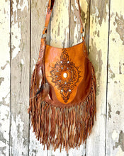 Load image into Gallery viewer, Sahara tan boho leather fringe crossbody bag with handcrafted mandala detailing and long flowing leather fringe