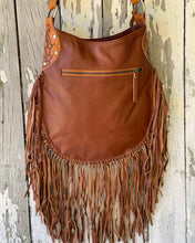 Load image into Gallery viewer, Rear view of Sahara tan leather fringe crossbody bag showing genuine leather, long fringe and rear zip pocket