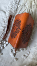 Load image into Gallery viewer, Top view of Sienna Soul hand tooled leather wallet showing mandala detailing on front and back.
