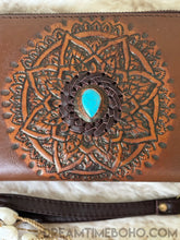 Load image into Gallery viewer, Close up of Sienna tooled leather wallet featuring intricate mandala design and turquoise stone