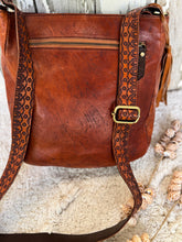 Load image into Gallery viewer, Back view of soft leather mandala crossbody bag showing external zip pocket and detailed strap