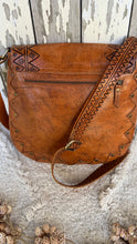 Load image into Gallery viewer, Studded leather boho crossbody bag showing handcrafted back detailing and adjustable leather strap