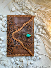 Load image into Gallery viewer, Tan hand tooled leather wallet with turquoise stone and mandala detail, a unique handcrafted boho accessories piece