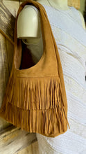 Load image into Gallery viewer, Close-up of tan suede leather boho shoulder bag featuring soft suede texture and layered fringe detail