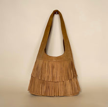 Load image into Gallery viewer, Tan suede leather fringe shoulder bag with double layered fringe against neutral studio background.