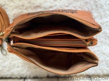 Load image into Gallery viewer, Open turquoise mandala leather crossbody clutch showing spacious interior compartments, card slots and zip pocket