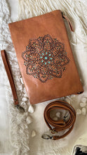 Load image into Gallery viewer, Hand tooled tan leather crossbody clutch with turquoise mandala detailing, removable wrist strap and adjustable shoulder strap By Dreamtime Boho