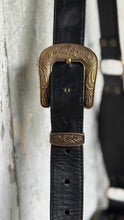 Load image into Gallery viewer,     Adjustable black leather crossbody strap with antique western buckle and detailed hardware.