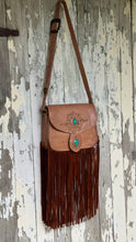 Load image into Gallery viewer, Handcrafted Wild Sierra boho leather bag in tan with turquoise stone features, adjustable leather strap and long flowing suede fringe.