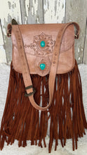 Load image into Gallery viewer, Wild Sierra tan leather boho crossbody bag showing detailed hand-tooled adjustable strap, turquoise stone features and long suede fringe.