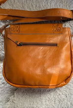 Load image into Gallery viewer, Rear view of the Wildflower Bloom genuine leather crossbody bag showing the rear zip pocket and adjustable leather strap.