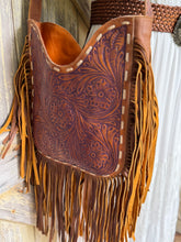 Load image into Gallery viewer, Side view of hand tooled floral leather boho fringe handbag with layered tan and brown fringe