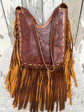 Load image into Gallery viewer, Hand tooled leather boho fringe shoulder bag with floral carved panel and two tone leather fringe