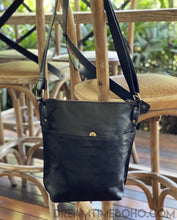Load image into Gallery viewer, Back view of black Dragonfly leather crossbody bag with large magnetic closure pocket